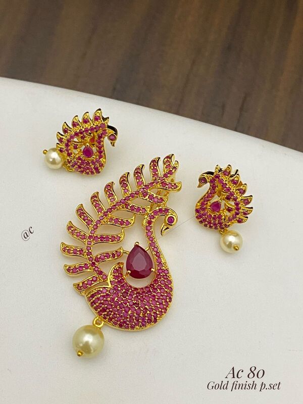 Gold finish peacock pendant set